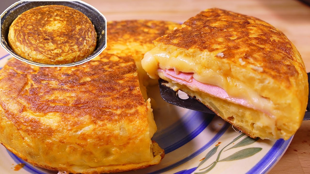 como hacer la tortilla española de patatas ¡FAMOSÍSIMA y rellena con jamon y queso!
